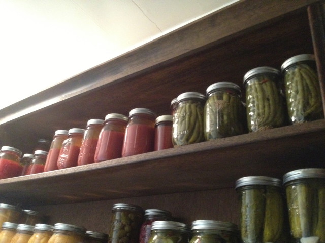 Top shelf: tomato juice, Bloody Mary mix, dilly beans.